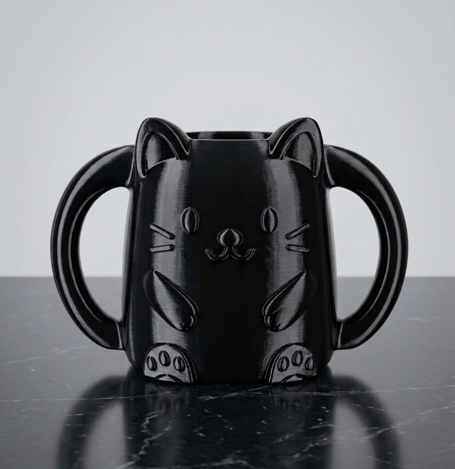 Glossy black 3D printed cat juice box holder with dual handles to prevent kids squeezing drinks